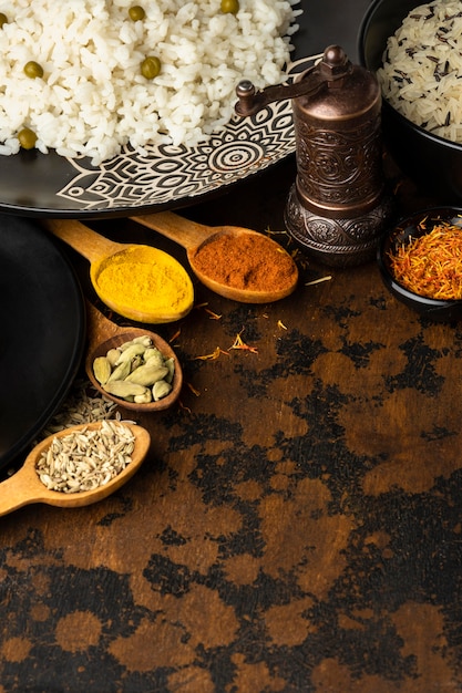 Free photo high angle spoons with spices