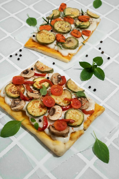 Free photo high angle square pizza with vegetables