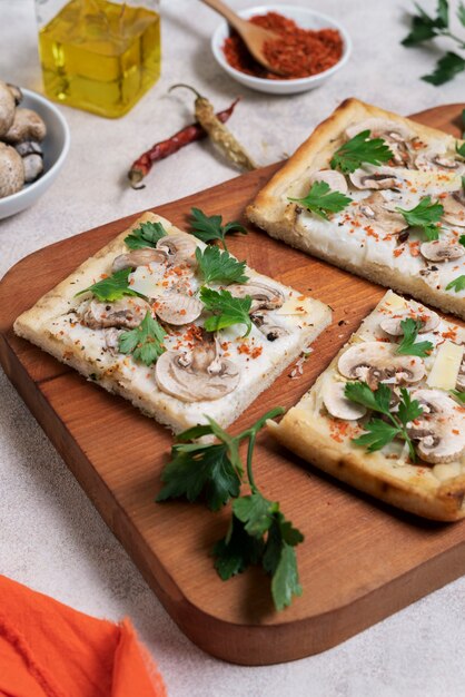 High angle square pizza on wooden board