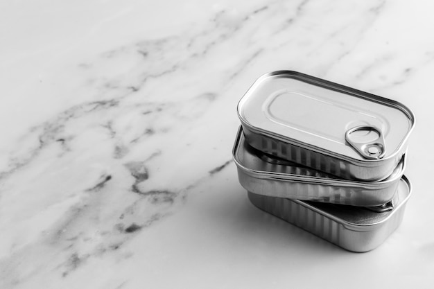 High angle stack of silver tin cans with copy-space