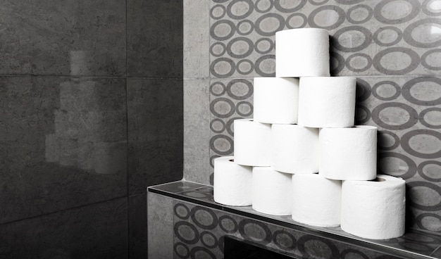 High angle stack of toilet paper rolls on shelf