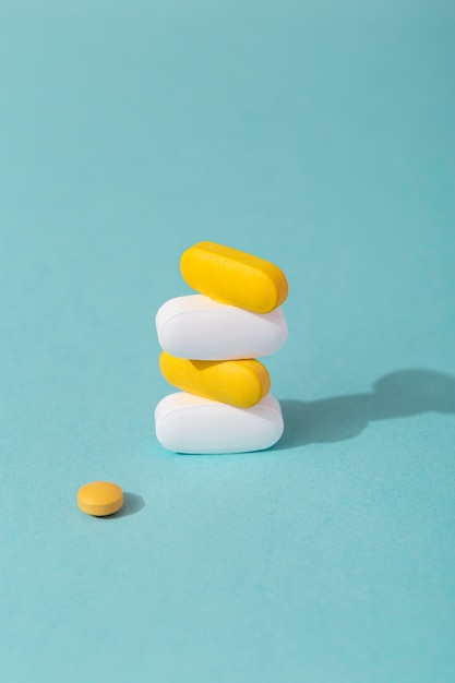 Free photo high angle of stacked colored pills