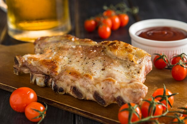 High angle of steak with beer and ketchup