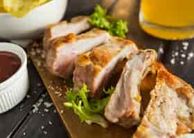 Free photo high angle of steak with salad and beer