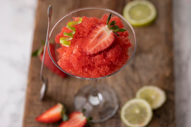 High angle strawberry granita dessert with lime