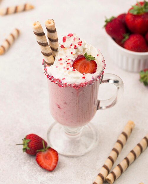 High angle of strawberry milkshake