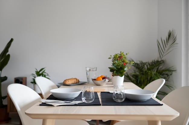 Free photo high angle table with cutlery and plates