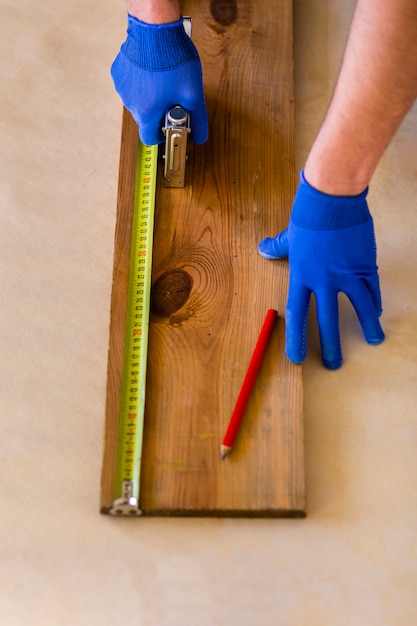 High angle of tape measure on wood