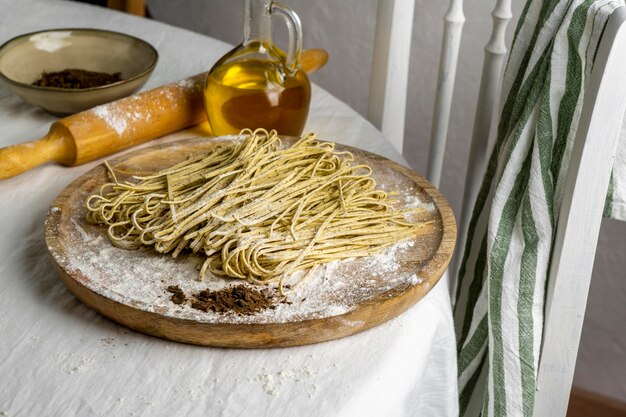 High angle tasty noodles on wooden board