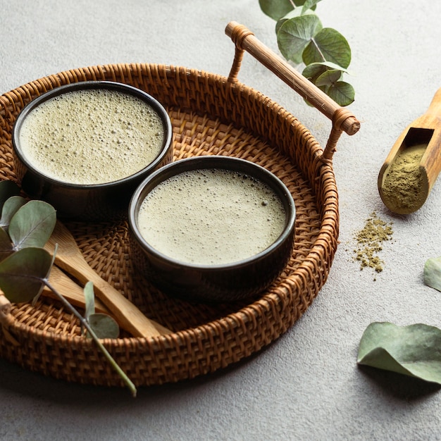 High angle tea cups and herbs