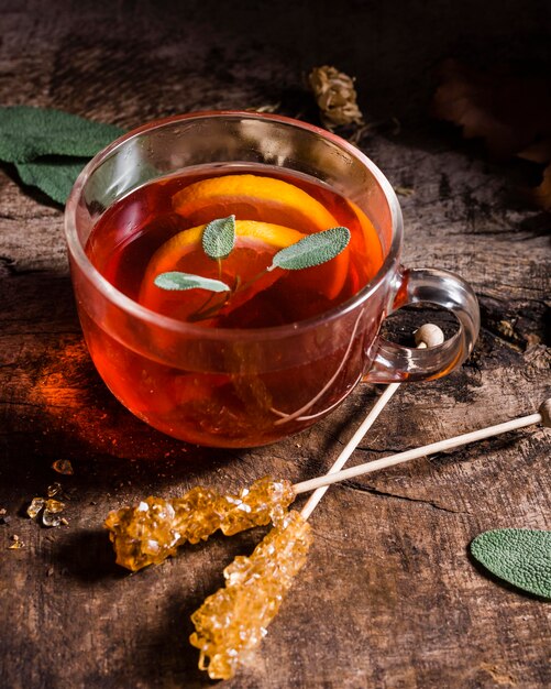 High angle tea with lemon slices and crystallized sugar canes