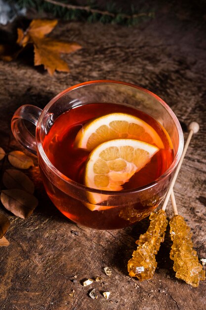 High angle tea with lemon slices and crystallized sugar