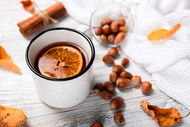 High angle of tea with orange