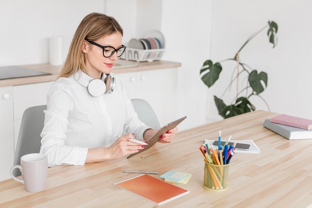 High angle teacher doing her classes online