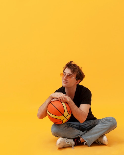 High angle teenager with basketball ball