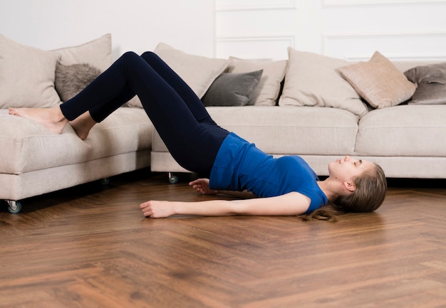 High angle teenager working out at home