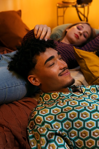 Free photo high angle teens laying together