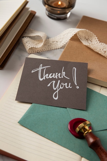 High angle thank you note and wax stamp