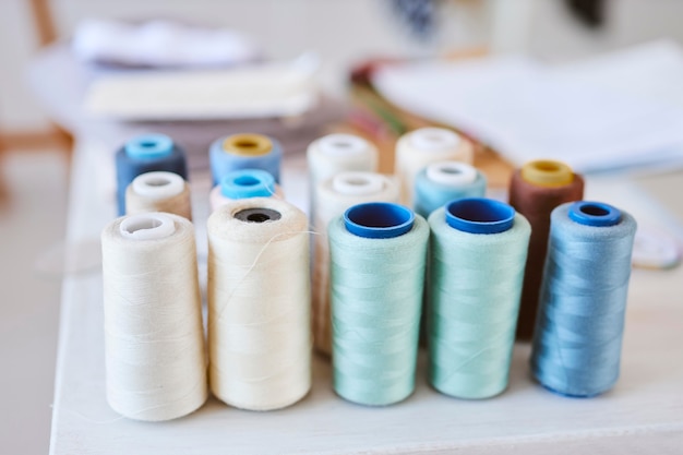 High angle of thread spools in fashion atelier