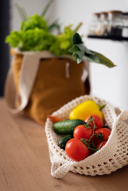 High angle tote bags with vegetables