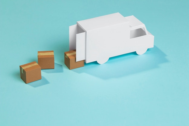 Free photo high angle toy delivery truck and boxes