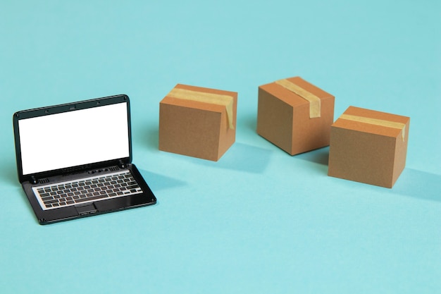 High angle toy laptop and boxes