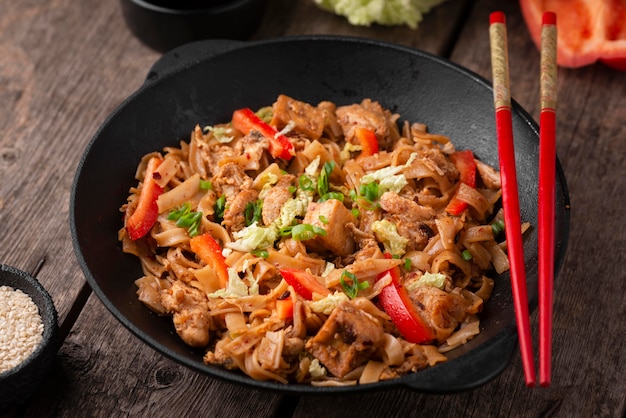 High angle of traditional asian dish with chopsticks