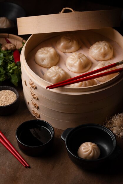 High angle of traditional asian dumplings with chopsticks