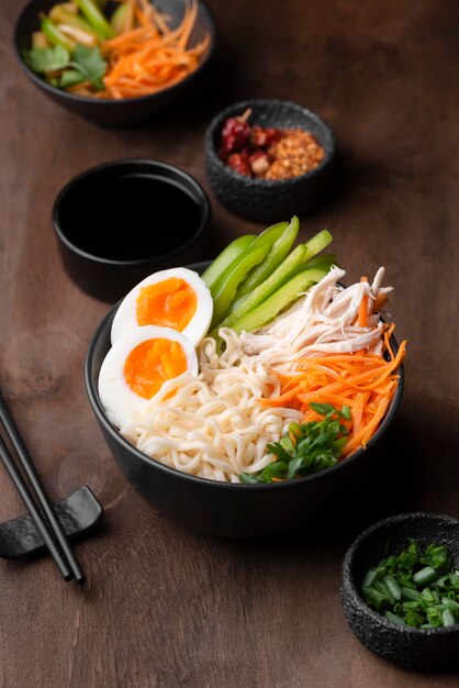 High angle of traditional asian noodles with eggs and vegetables