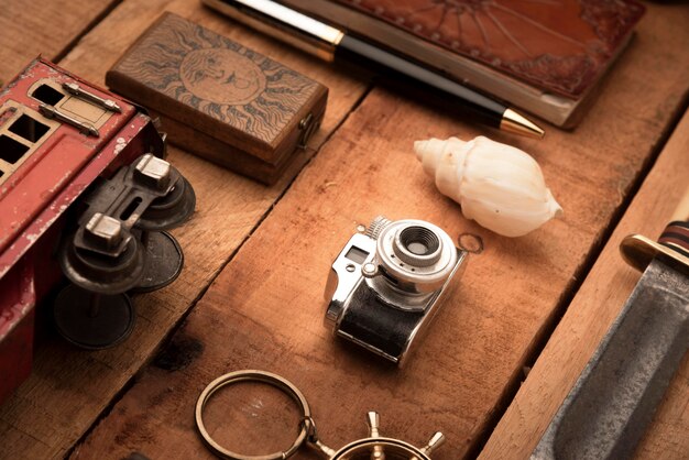 High angle travel items on wooden table