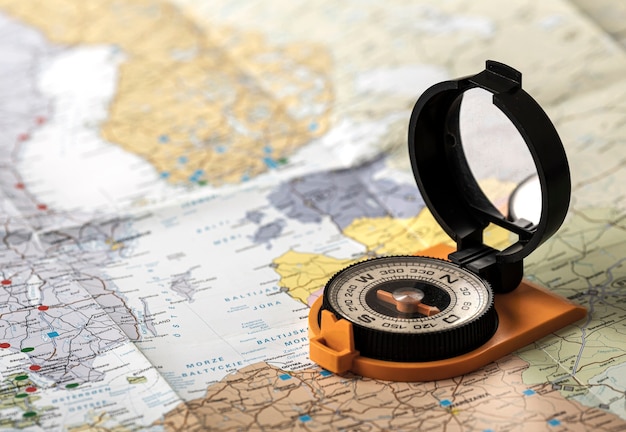 Free photo high angle travel set with compass on map