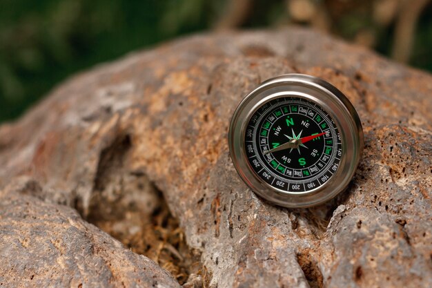 High angle traveler compass on rocks