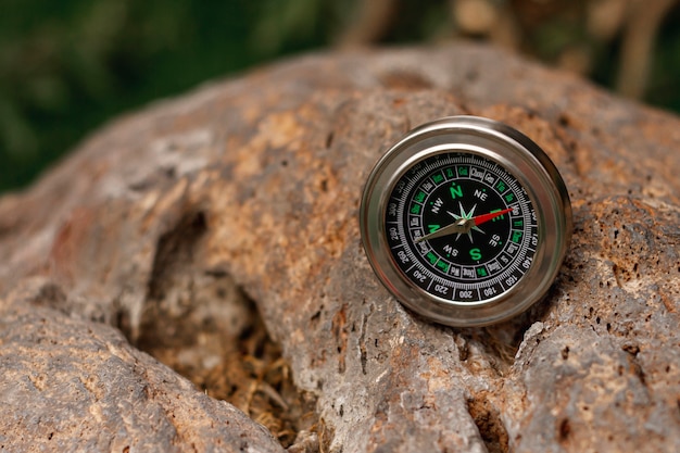 High angle traveler compass on rocks
