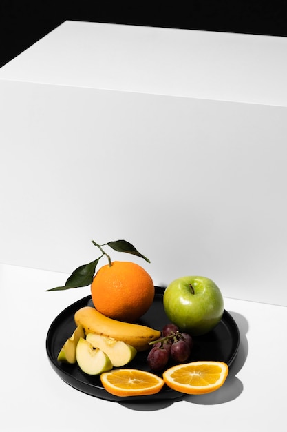 Free photo high angle of tray with fruits and copy space