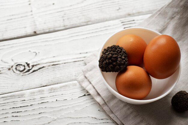 High angle truffles and eggs in bowl