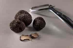 Free photo high angle truffles and tool arrangement