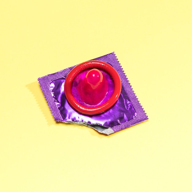 High angle unwrapped red condom