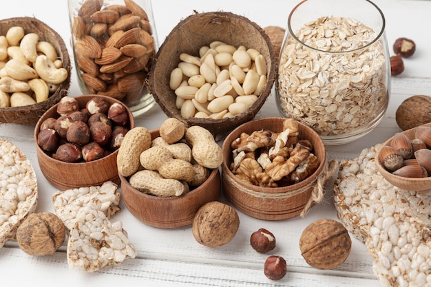 High angle of variety of nuts in bowls