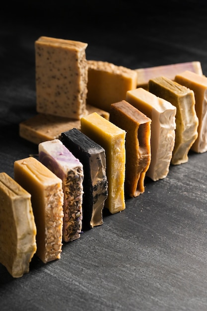 Free photo high angle of various soap aligned on table