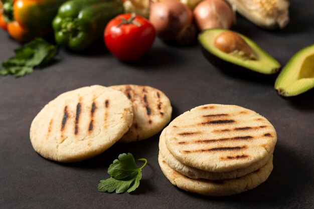 High angle vegetables and arepas arrangement