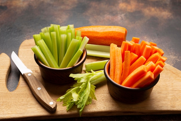 High angle vegetables and knife arrangement