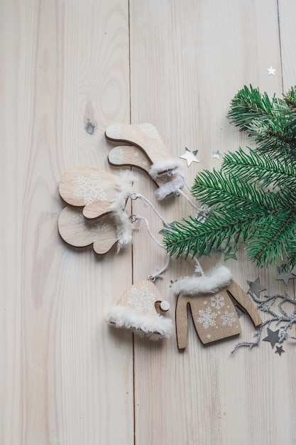 Free photo high angle vertical of wooden ornaments and christmas decorations on the table