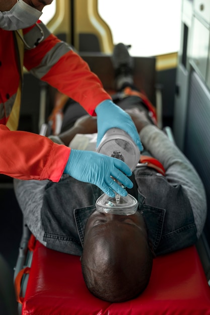 Free photo high angle victim with oxygen mask