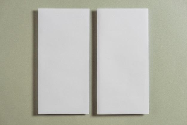 Free photo high angle view of blank papers on plain background