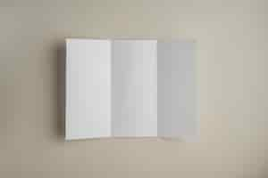 Free photo high angle view of blank white paper on colored background