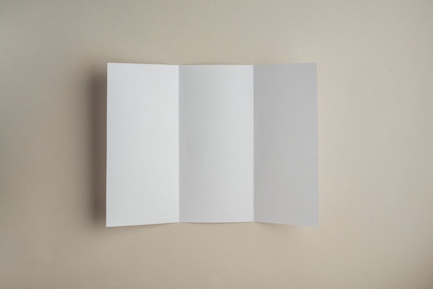 High angle view of blank white paper on colored background