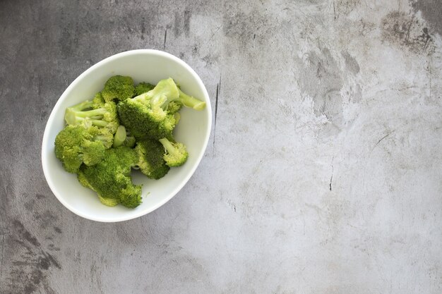 High angle view of broccoli in a white bowl on the table