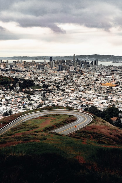 Free photo high-angle view of city buildings and gray pavement road