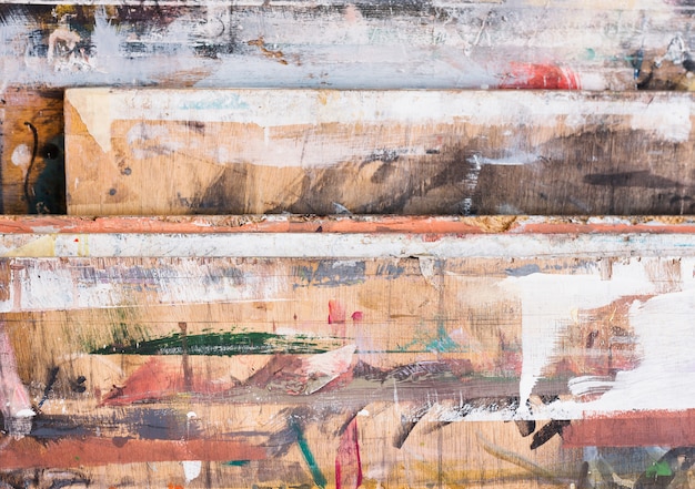 High angle view of colorful brushstroke on wooden textured