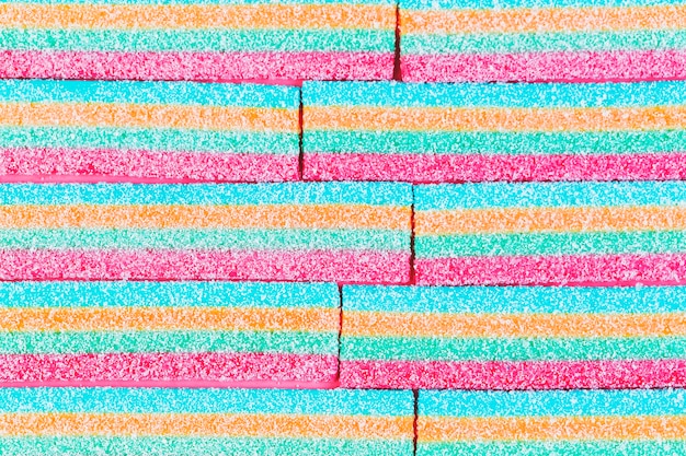 Free photo high angle view of colorful striped sugar candies